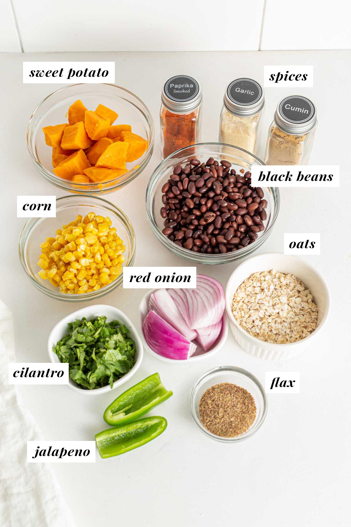 Various cooking ingredients in dishes on a counter.