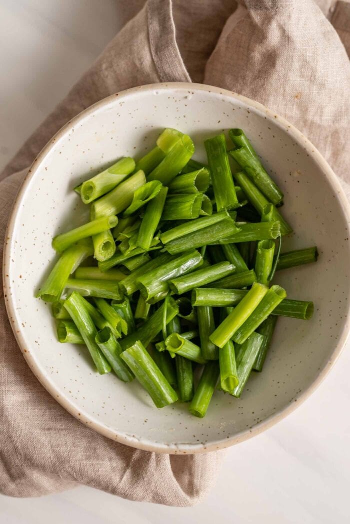 Chopped green onions in a bowl.