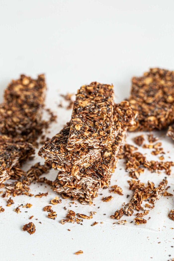 A stack of 3 chocolate chia energy bars with oats.