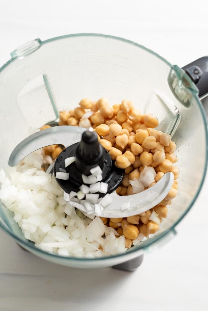 Chickpeas and diced onion in a food processor.