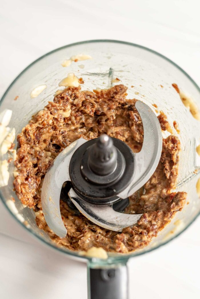 A date and banana mixture blended up in a food processor.