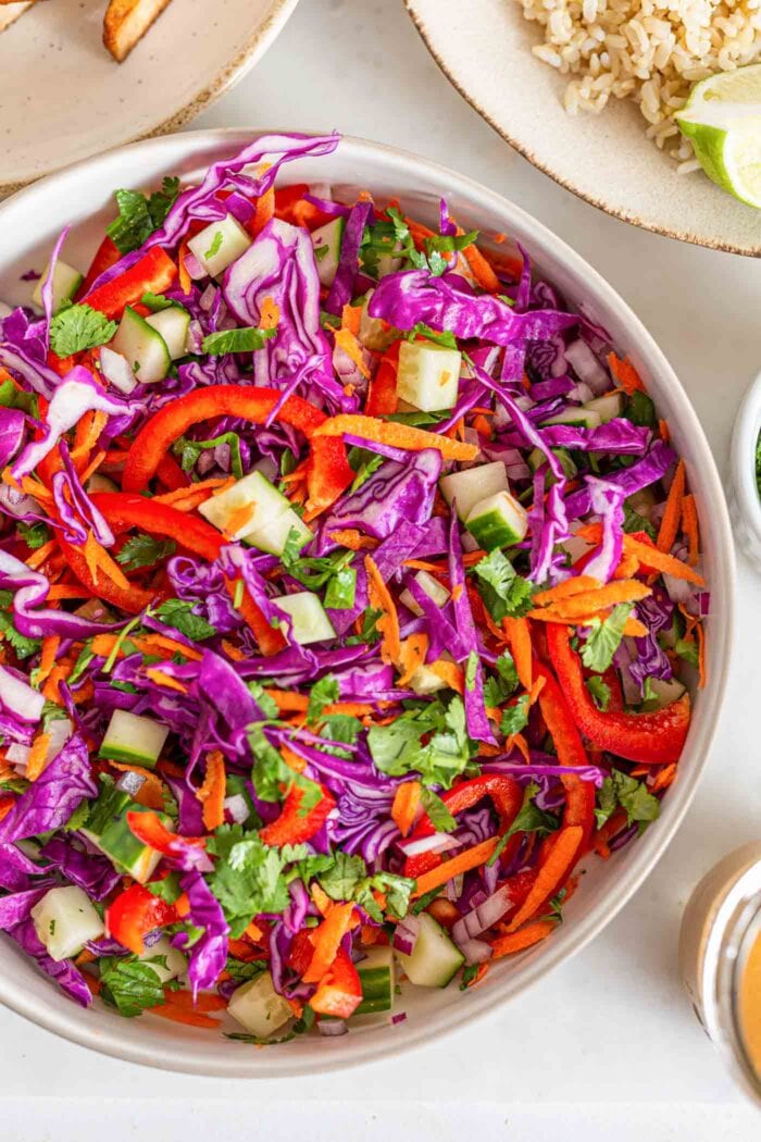 Mixed colorful chopped fresh veggies in a large bowl.