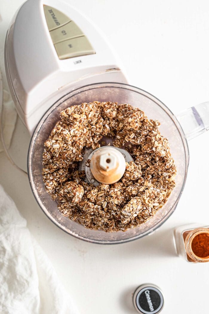 Blended dates and oats in a food processor.