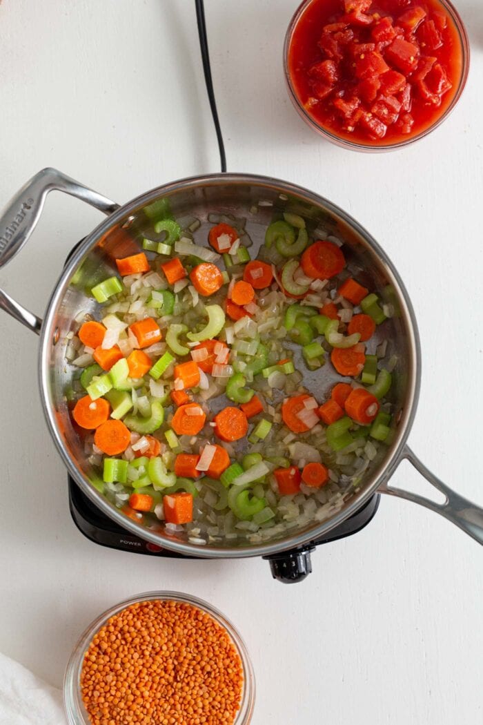 Onion, garlic, carrots and celery sauteed in a skillet.