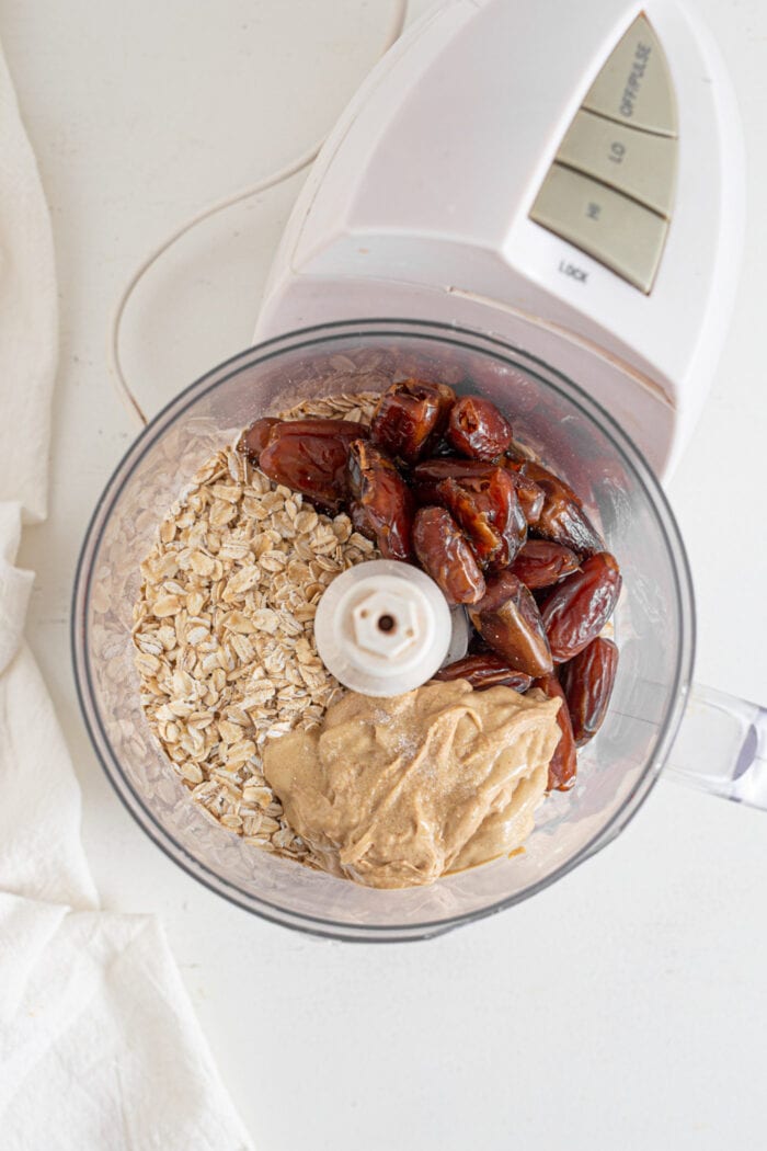 Oats, dates and tahini in a food processor.