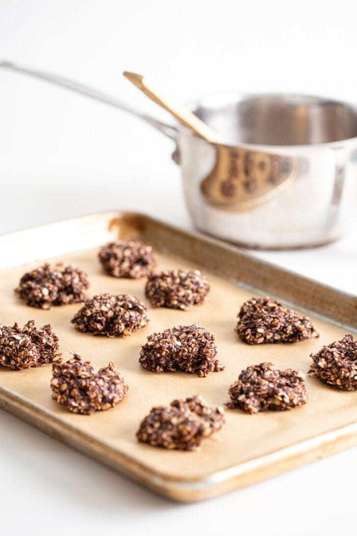 No-bake gingerbread oatmeal cookies on a baking sheet lined with parchment paper.