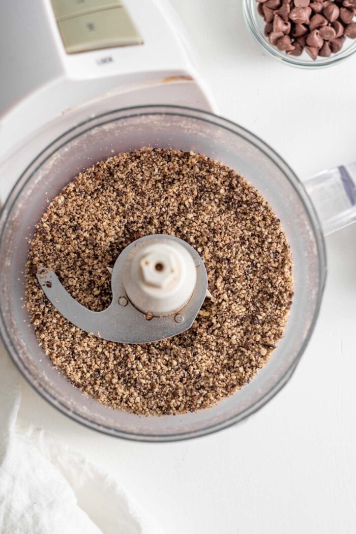 Raw cashews and coffee beans blended together in a food processor.