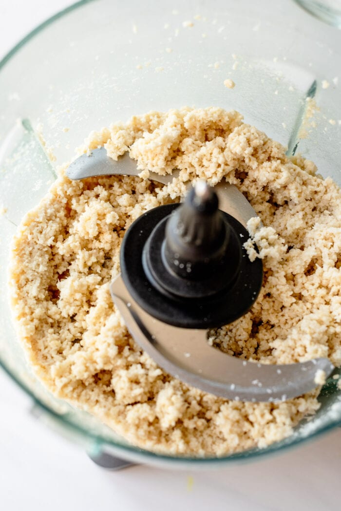 Cashews and shredded coconut blended into a crumbly dough in a food processor.