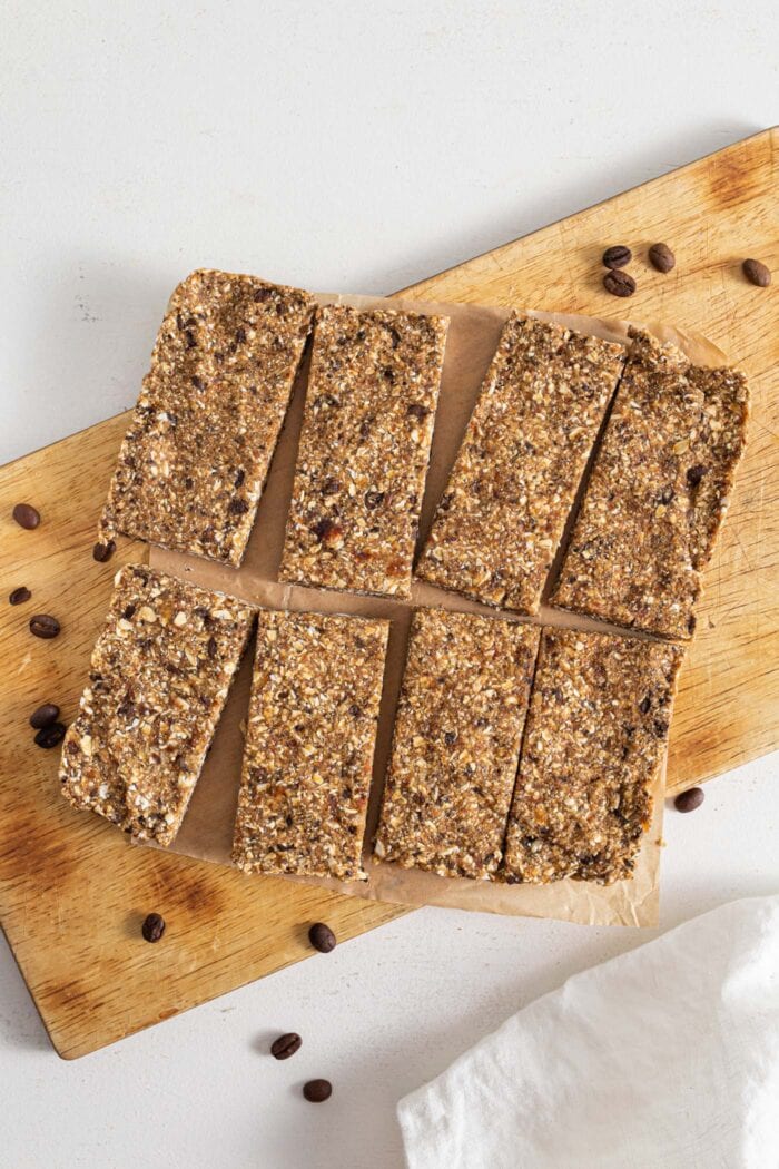 Energy bars cut into 8 portions on cutting board.