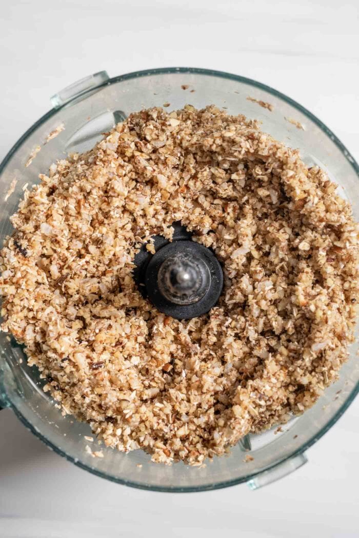 Blended oats, nuts and brown rice in a food processor.