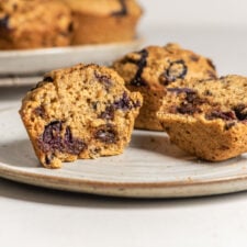 Sliced open chickpea flour chocolate chip muffin showing inside texture of muffin.