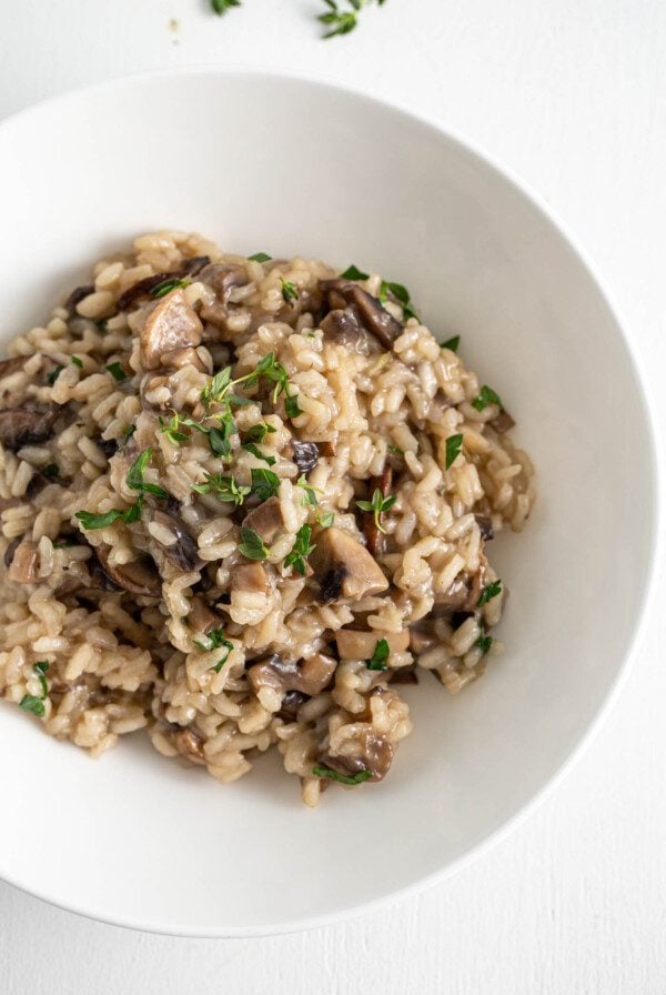 Overhead image of vegan mushroom topped with parsley in a bowl.