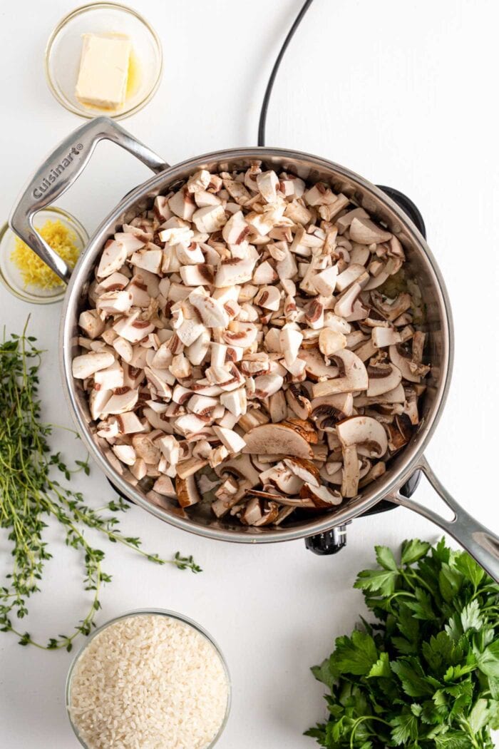 Chopped mushrooms cooked in a skillet.