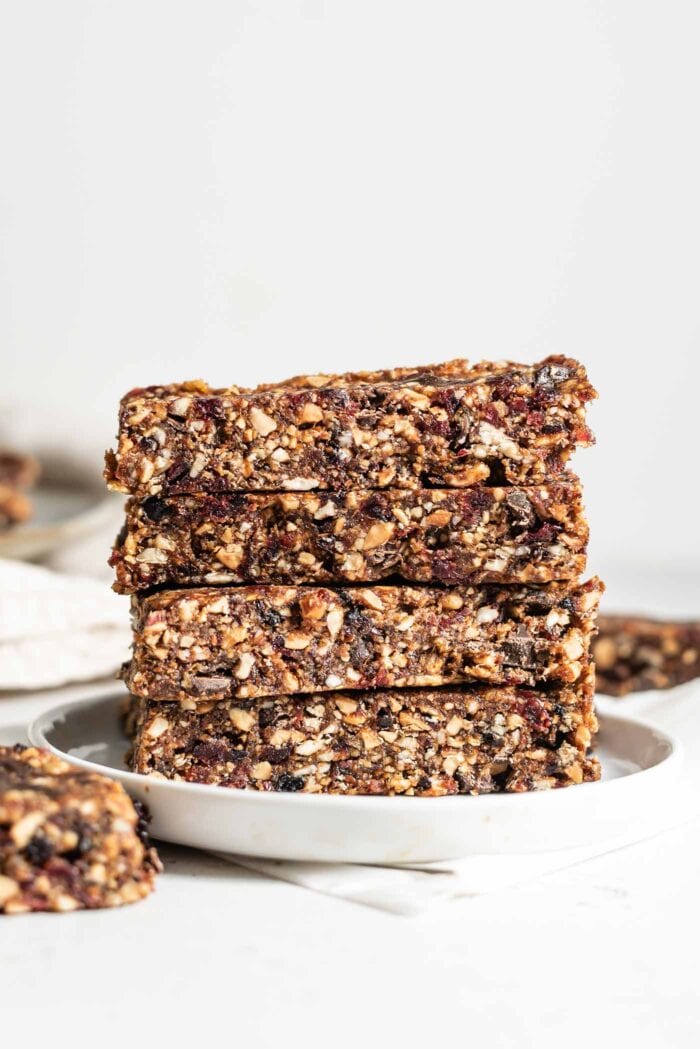 Stack of 4 energy bars on a small plate.