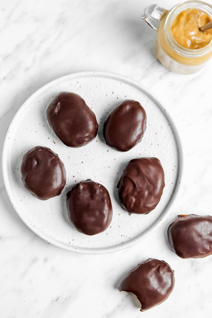 A plate of homemade chocolate-covered peanut butter eggs.