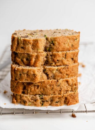 Stack of 5 thick slices of zucchini bread.