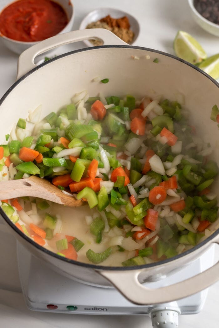 Celery, carrot, onion, garlic and jalapeno cooking in a large soup pot.