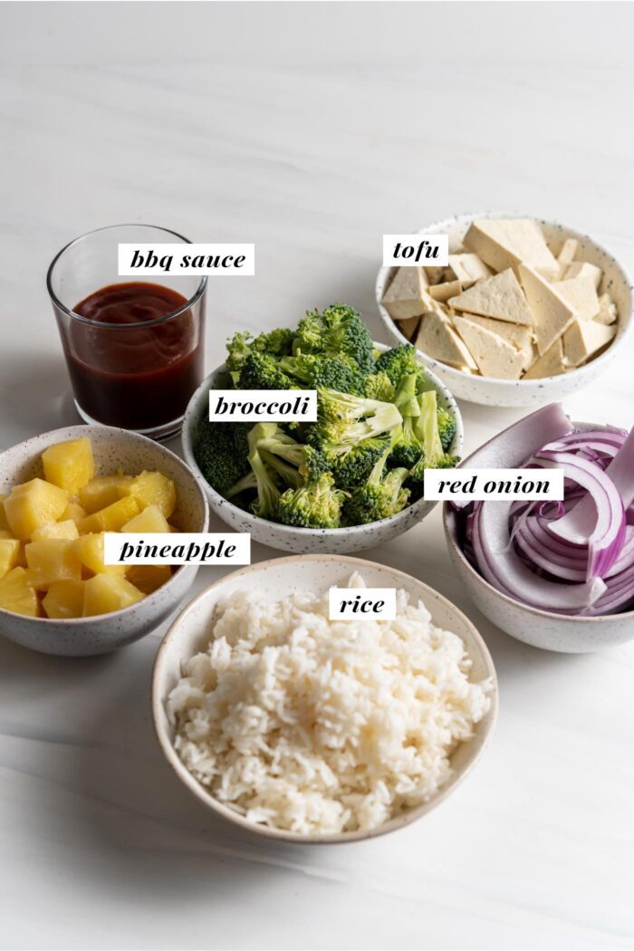 Visual of ingredients needed for making bbq tofu bowls. Each ingredient is labelled with text overlay.