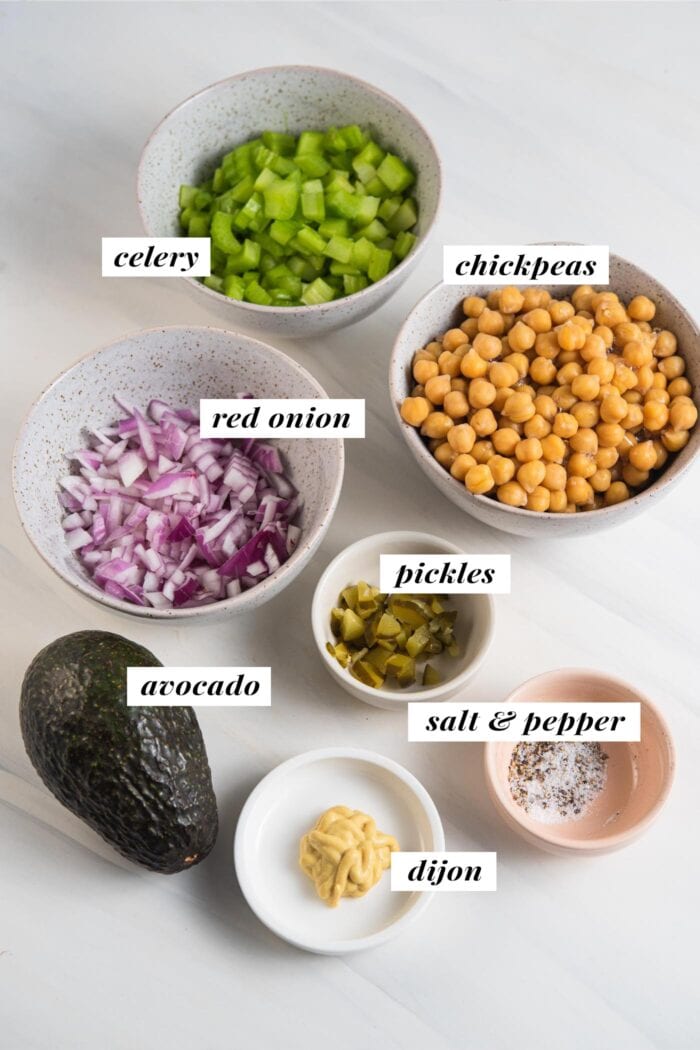 Visual of ingredients needed for making chickpea salad, each ingredient labelled with text.