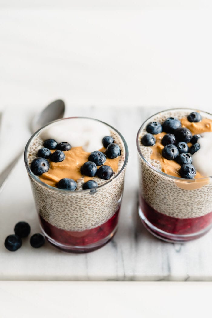 Chia pudding topped with blueberries, yogurt and peanut butter.