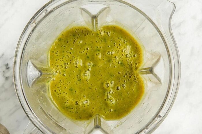 Blended broccoli soup in a blender.