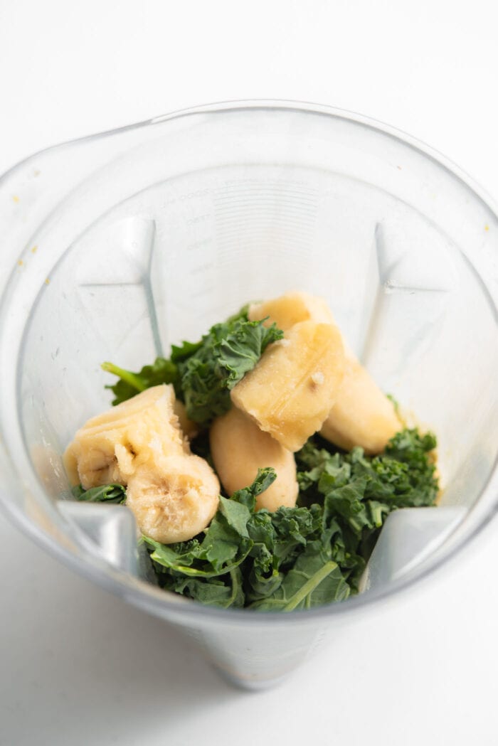 Banana and kale in a blender.
