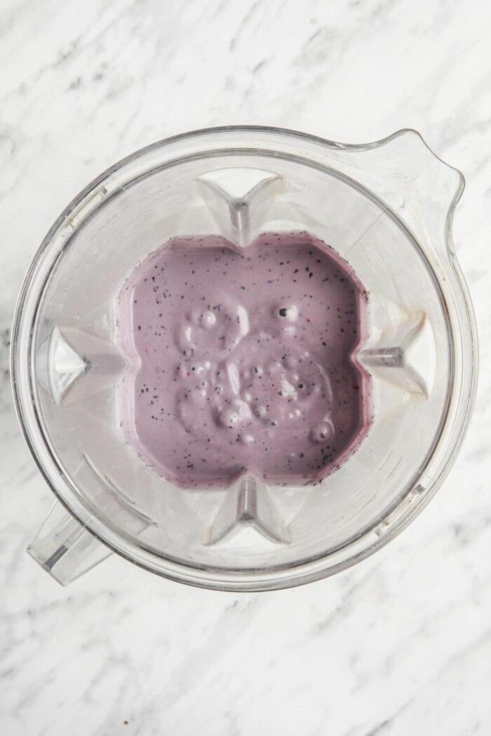 Blended blueberry cheesecake filling in a Vitamix blender.