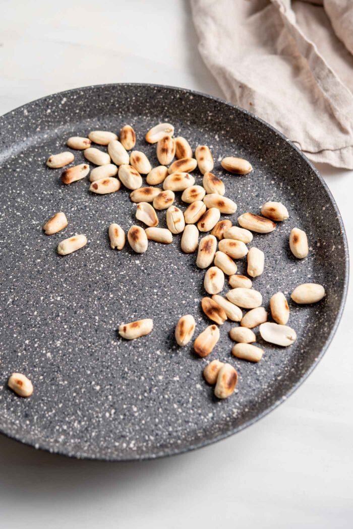 Toasting peanuts in a dry skillet.