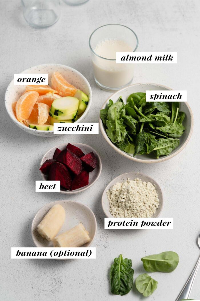 Visual of ingredients needed for making a beet orange protein smoothie, each ingredient labelled with text overlay.