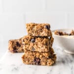 Stack of 3 baked blueberry quinoa oatmeal bars.