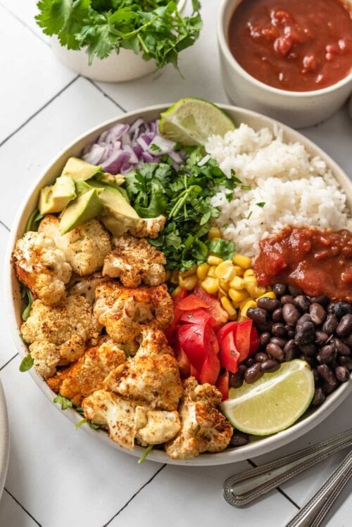 Roasted Cauliflower Burrito Bowls - Running on Real Food