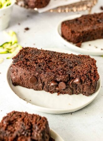 Thick slice of chocolate chip zucchini bread on a plate.