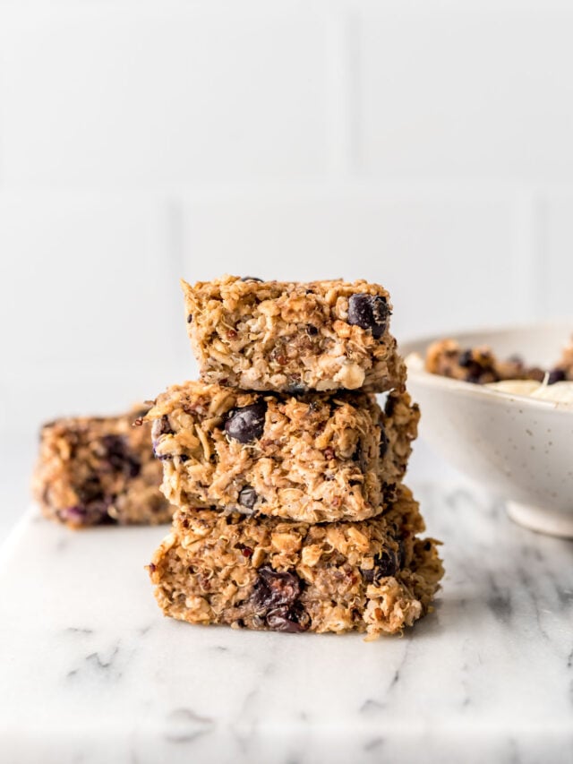Stack of 3 baked blueberry quinoa oatmeal bars.