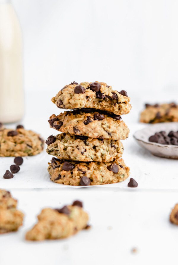 Stack of 4 chocolate chip zucchini cookies. One on the top has a bite out of it.