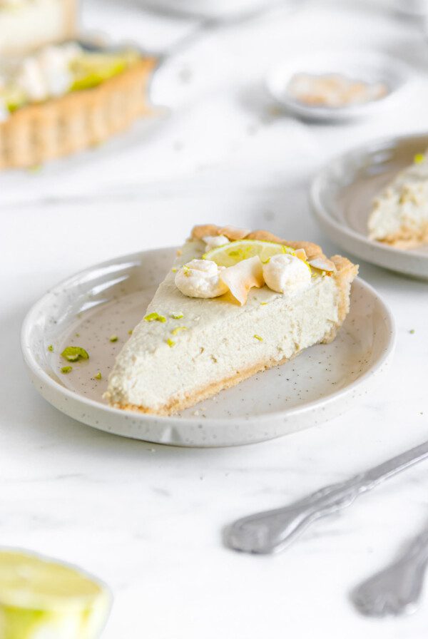 Slice of key lime pie on a plate.