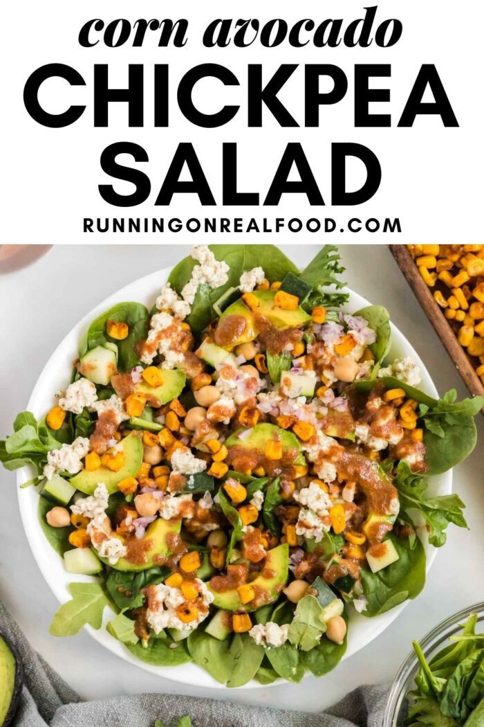 Pinterest graphic with an image of avocado corn salad with dressing and text reading: corn avocado chickpea salad.