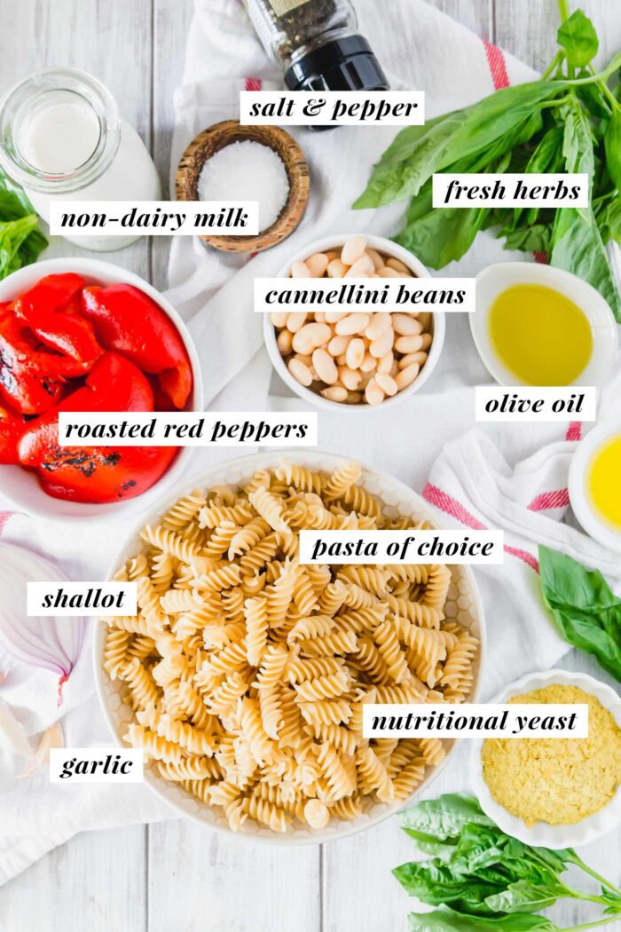 Visual list of ingredients for making creamy vegan roasted red pepper pasta with beans and nutritional yeast.