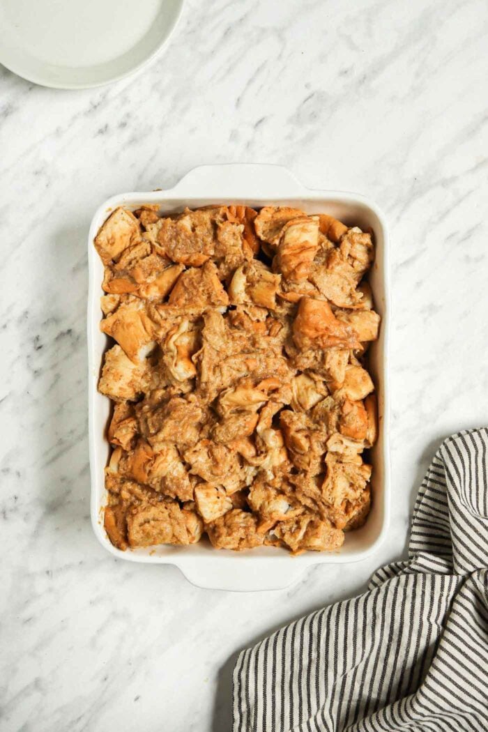 Unbaked french toast casserole in a rectangular casserole dish.