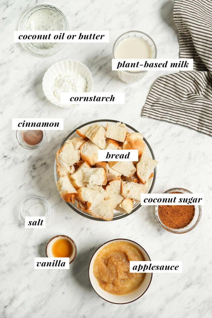 All the ingredients needed for making a baked french toast casserole. Each ingredient is labelled with text overlay.