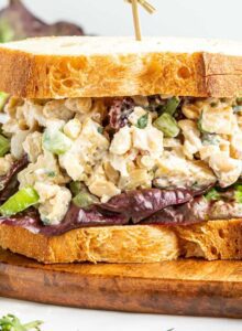 Vegan chicken salad made with tempeh on a sandwich with lettuce.
