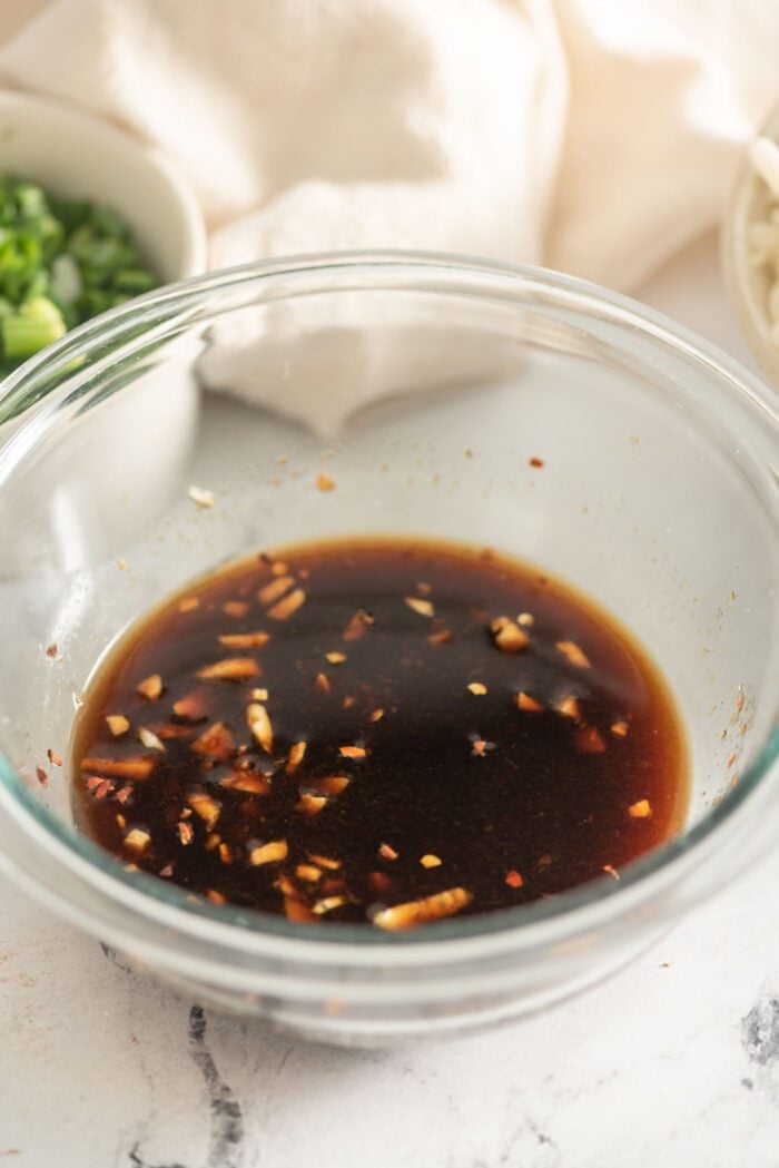 Udon noodle stir fry sauce mixed in a small glass bowl.