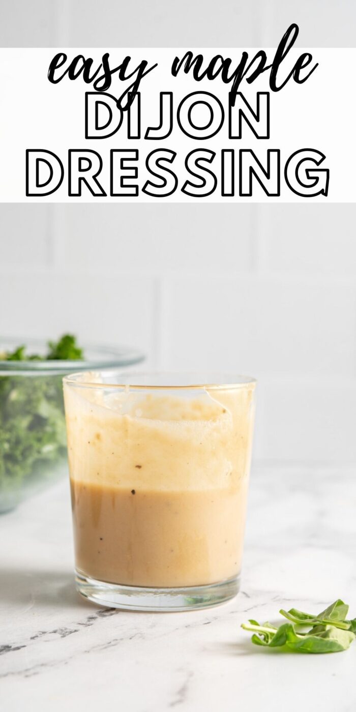 Jar of creamy salad dressing on a marble surface and text reading "easy maple dijon dressing".