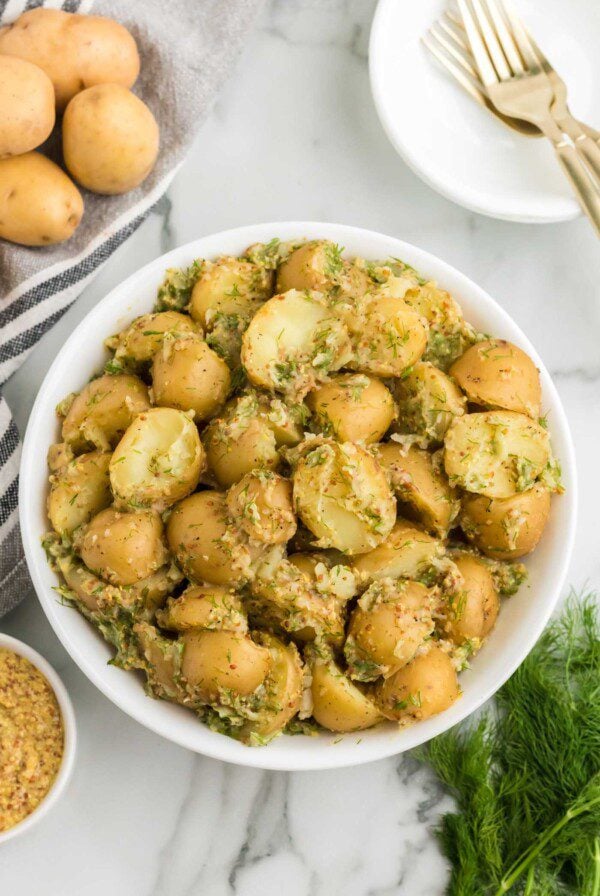 Bowl of tangy dill and dijon potato salad made without mayonnaise.