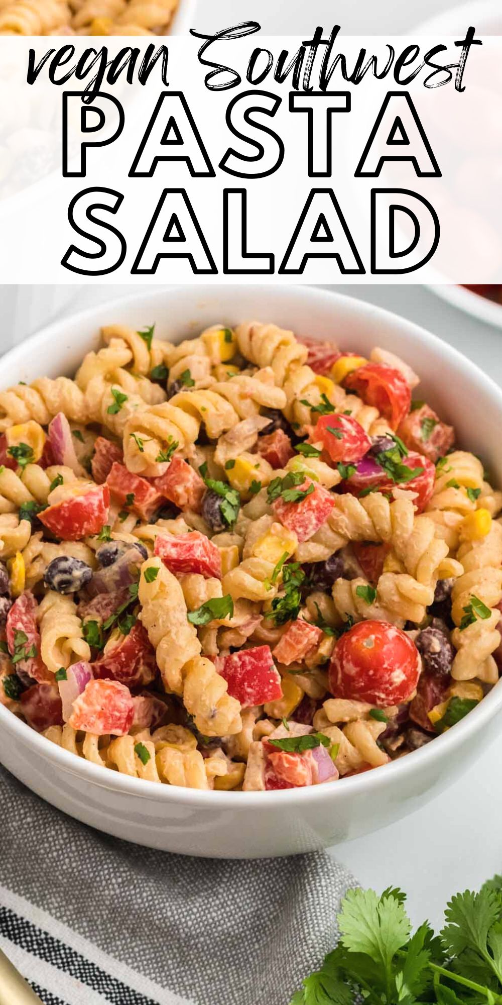 Bowl of Southwest pasta salad with beans and veggies and a text header reading "vegan Southwest pasta salad".