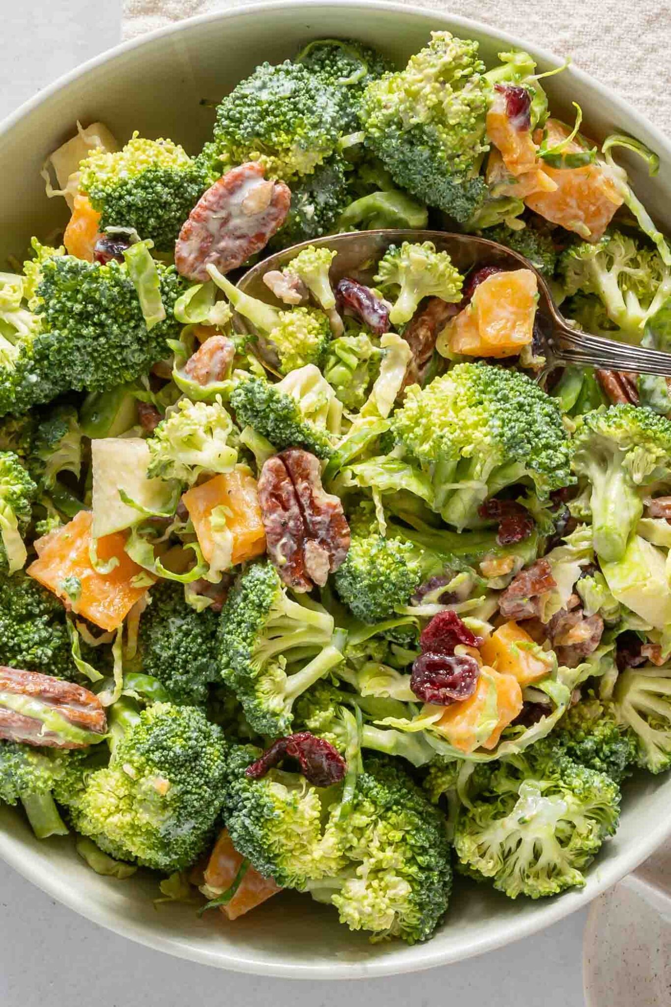 Creamy Broccoli Apple Salad with Cranberries and Brussels Sprouts