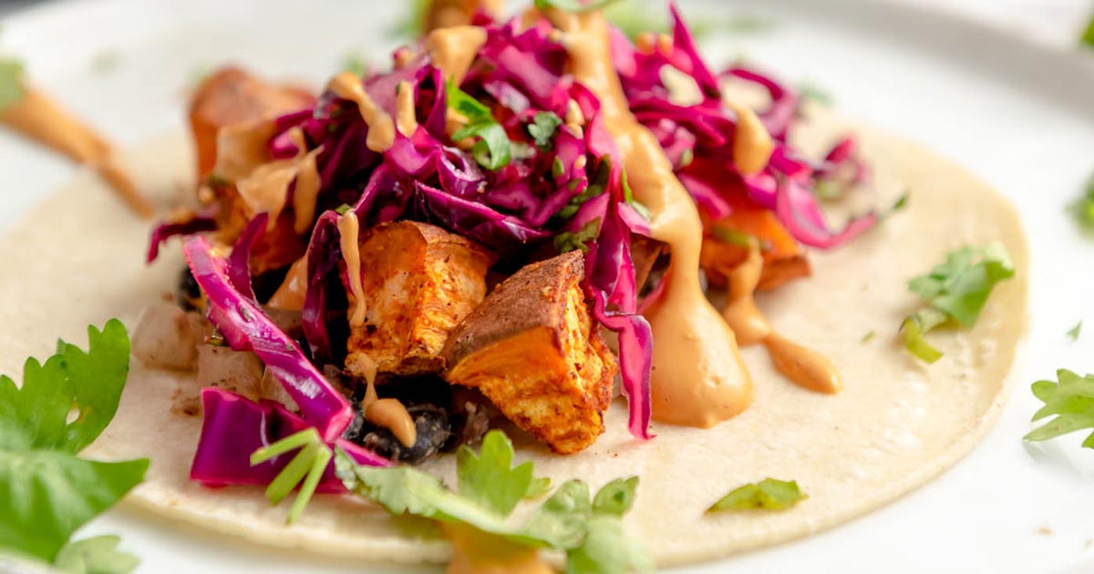 Sweet Potato Black Bean Tacos with Queso and Cabbage Slaw