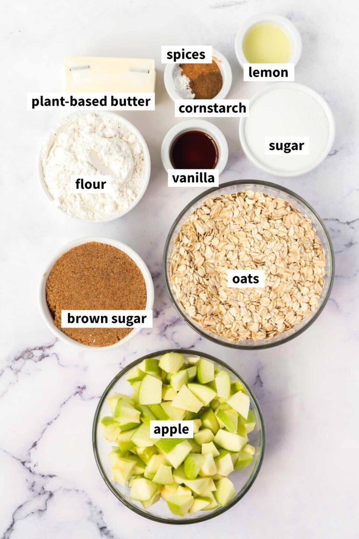 The ingredients for making a vegan apple crumbles bar recipe. Each ingredient is labelled with text.