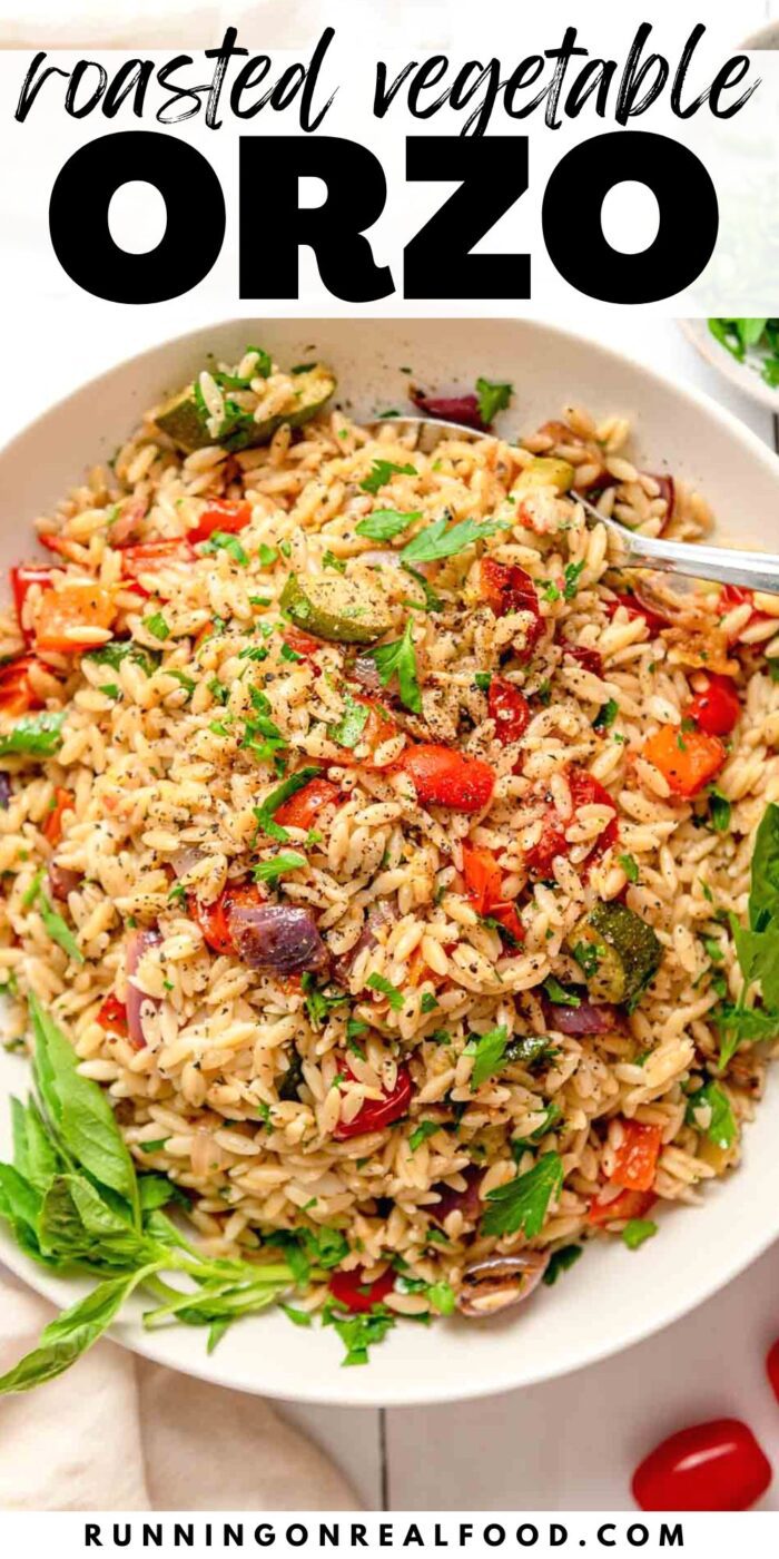 A Pinterest graphic with an image of a large bowl of a orzo with roasted tomato, onion and zucchini wth text above it reading "roasted vegetable orzo".