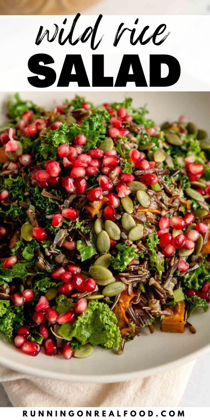 Pinterest style graphic with an image of a wild rice salad with pomegranate and stylized text reading "wild rice salad".