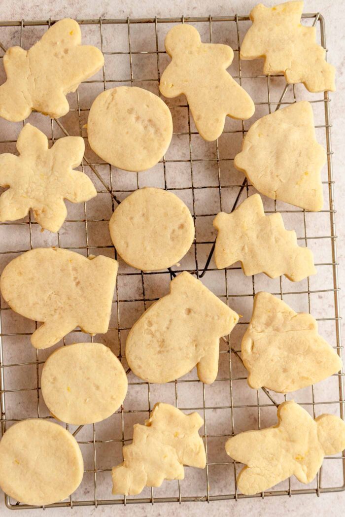Baked lemon shortbread cookies in the shapes of men, trees, starts and bells.